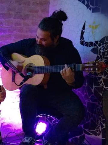 Steven Arispe performing flamenco guitar